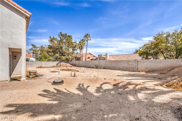 view of yard with a fenced backyard