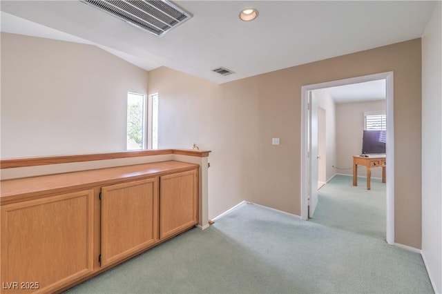 hall featuring light carpet, recessed lighting, visible vents, and baseboards