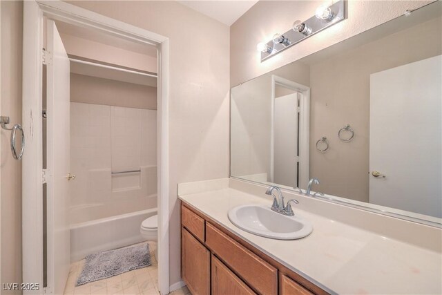 bathroom with toilet and vanity
