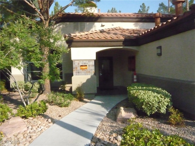 9000 Las Vegas Blvd Unit 1047, Las Vegas, NV 89123 - view of exterior entry featuring stucco siding, a tiled roof, and stone siding
