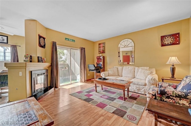 9000 Las Vegas Blvd Unit 1047, Las Vegas, NV 89123 - living room with wood finished floors, a fireplace, and plenty of natural light