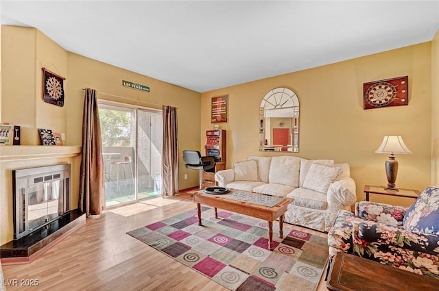 9000 Las Vegas Blvd Unit 1047, Las Vegas, NV 89123 - living area with wood finished floors and a fireplace with raised hearth