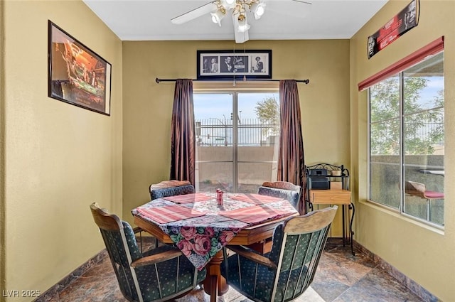 9000 Las Vegas Blvd Unit 1047, Las Vegas, NV 89123 - dining area with baseboards, a ceiling fan, a healthy amount of sunlight, and stone finish floor