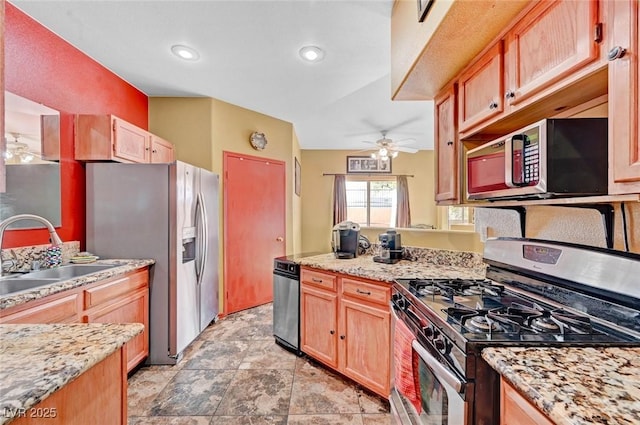 9000 Las Vegas Blvd Unit 1047, Las Vegas, NV 89123 - kitchen featuring a sink, stainless steel appliances, ceiling fan, a peninsula, and light stone counters