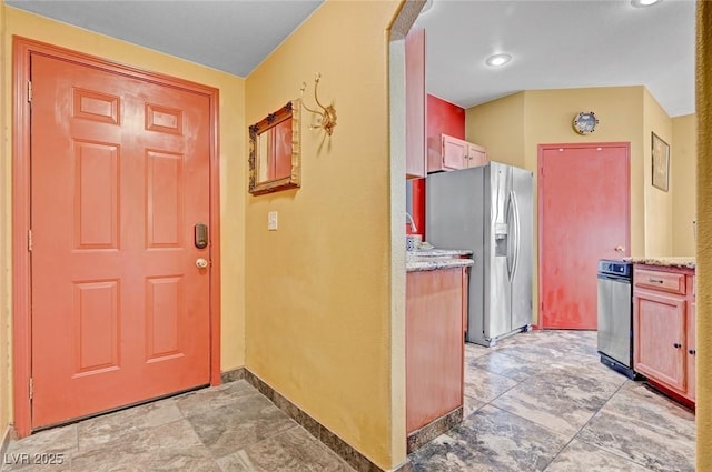9000 Las Vegas Blvd Unit 1047, Las Vegas, NV 89123 - kitchen with light stone counters, stainless steel refrigerator with ice dispenser, and baseboards