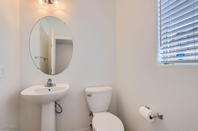 bathroom featuring toilet