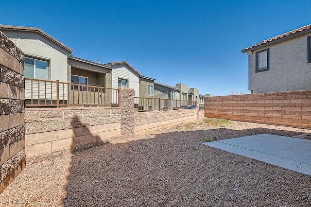 view of yard with a patio area, a residential view, and a fenced backyard