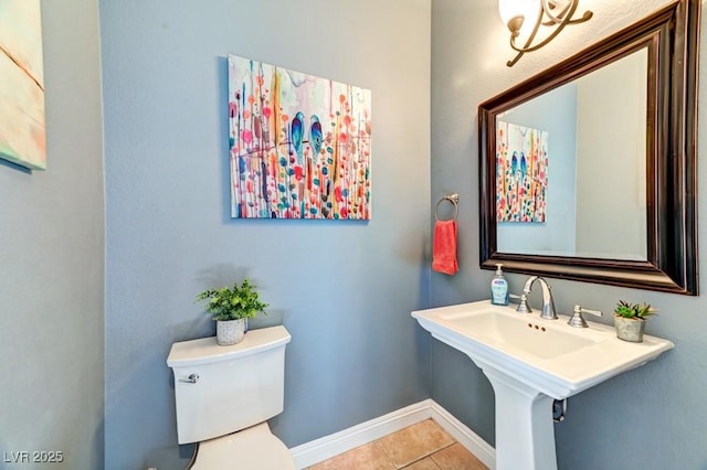 8209 Chapelle Ct, Las Vegas, NV 89131 - half bath featuring tile patterned flooring, toilet, and baseboards