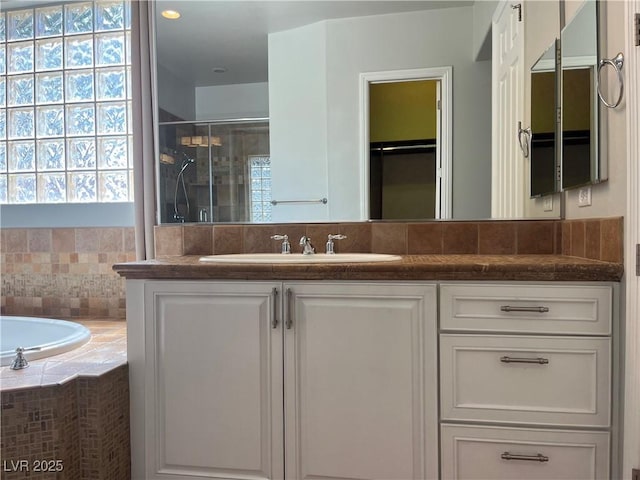 8209 Chapelle Ct, Las Vegas, NV 89131 - full bath with a shower stall, vanity, and a garden tub