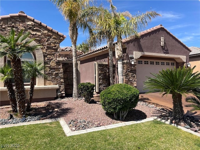 8209 Chapelle Ct, Las Vegas, NV 89131 - view of front facade featuring stucco siding, a tile roof, an attached garage, and stone siding