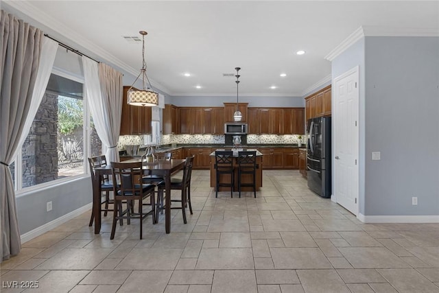 8209 Chapelle Ct, Las Vegas, NV 89131 - dining space with ornamental molding, baseboards, and recessed lighting