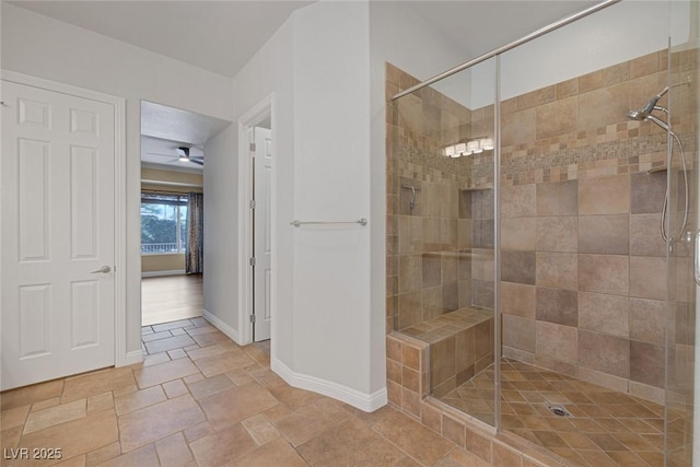 8209 Chapelle Ct, Las Vegas, NV 89131 - full bath featuring a stall shower, baseboards, stone tile floors, and ceiling fan