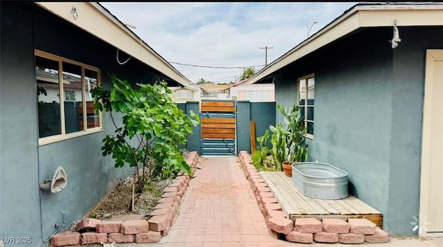 1801 Griffith Ave, Las Vegas, NV 89104 - view of property exterior featuring a gate and stucco siding