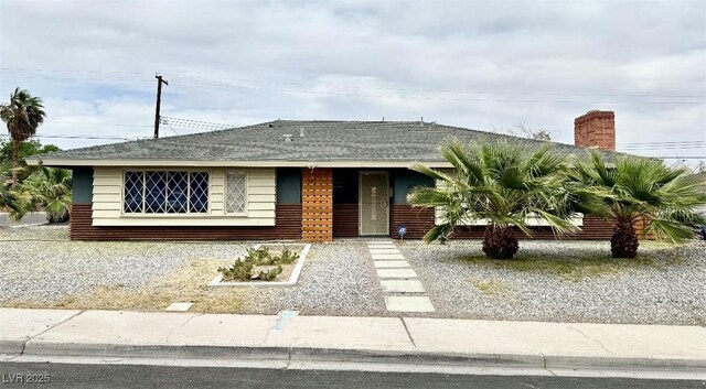 1801 Griffith Ave, Las Vegas, NV 89104 - single story home with a shingled roof and a chimney