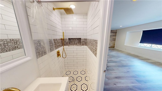 1801 Griffith Ave, Las Vegas, NV 89104 - bathroom featuring wood finished floors and a tile shower