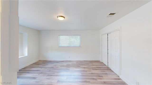 1801 Griffith Ave, Las Vegas, NV 89104 - unfurnished bedroom with light wood-type flooring and a closet