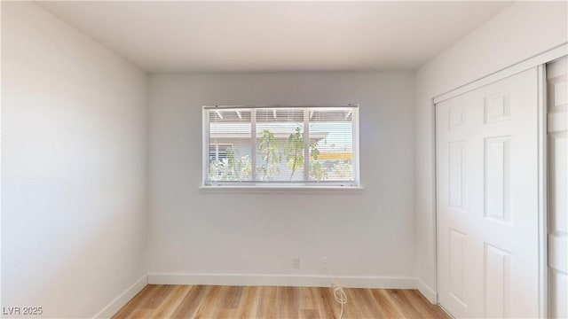 1801 Griffith Ave, Las Vegas, NV 89104 - unfurnished bedroom featuring light wood-style flooring and a closet