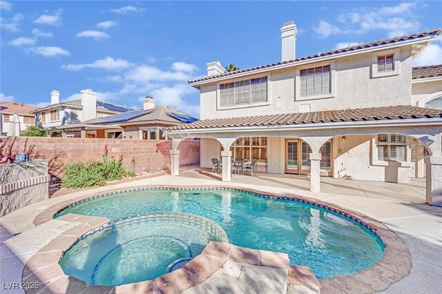 3755 Broadmead St, Las Vegas, NV 89147 - rear view of property with a pool with connected hot tub, stucco siding, a patio, a chimney, and a tile roof