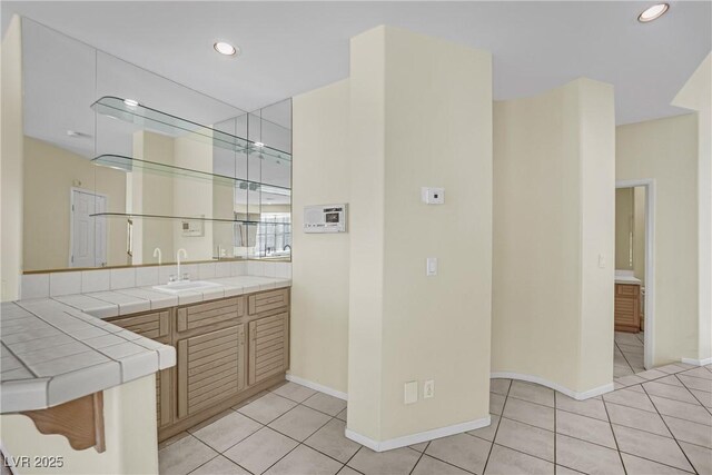 3755 Broadmead St, Las Vegas, NV 89147 - bar featuring light tile patterned floors, baseboards, recessed lighting, and a sink
