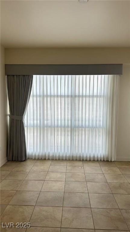 150 N Las Vegas Blvd Unit 818, Las Vegas, NV 89101 - empty room featuring light tile patterned flooring and baseboards