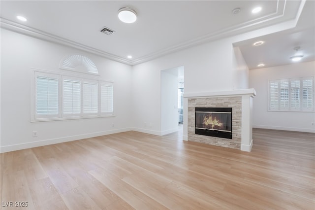 3057 Sunrise Heights Dr, Henderson, NV 89052 - unfurnished living room featuring light wood-type flooring, ornamental molding, a stone fireplace, visible vents, and recessed lighting