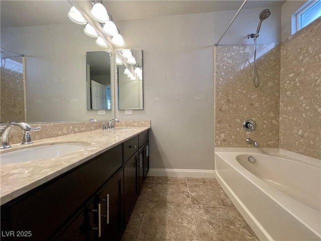 full bathroom featuring tile patterned floors, a sink,  shower combination, and double vanity
