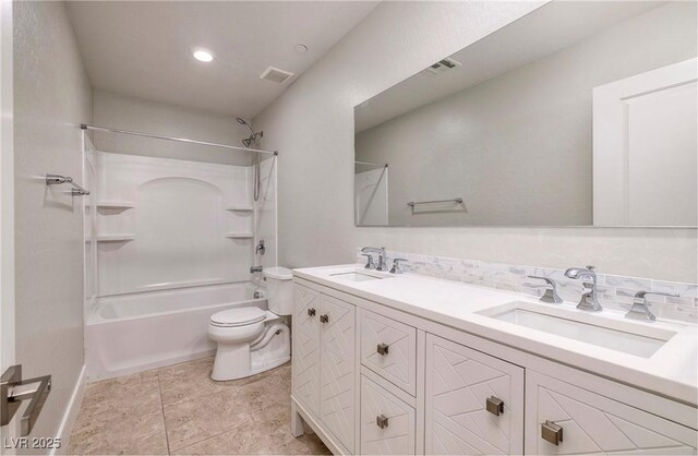full bath featuring double vanity, shower / bath combination, toilet, visible vents, and a sink