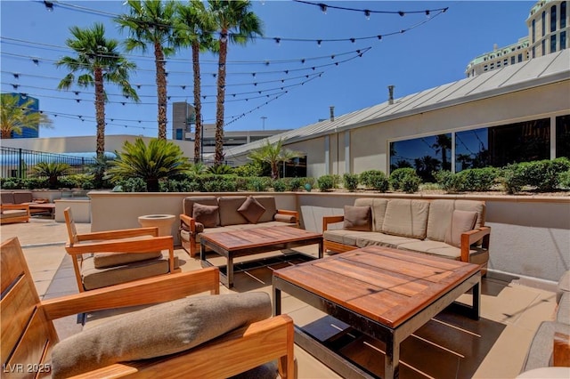 view of patio / terrace featuring fence and an outdoor hangout area