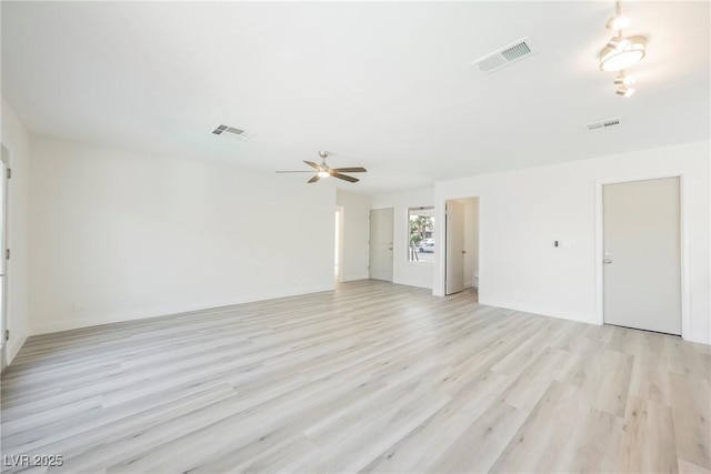 unfurnished living room with a ceiling fan, light wood-type flooring, and visible vents
