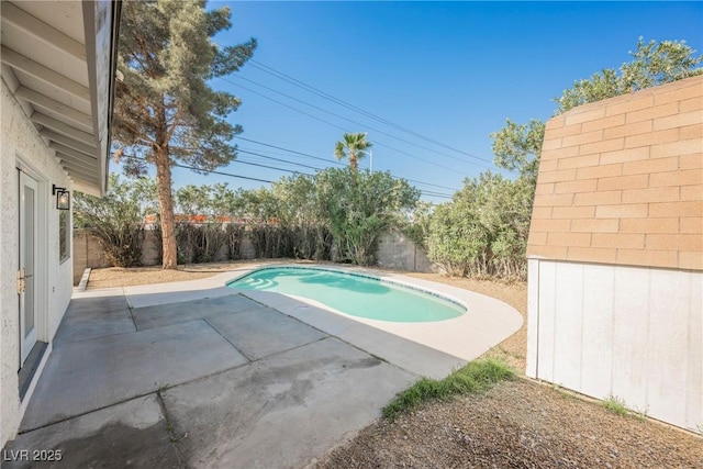 view of pool featuring a patio, a fenced in pool, and a fenced backyard