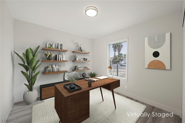 home office with wood finished floors and baseboards