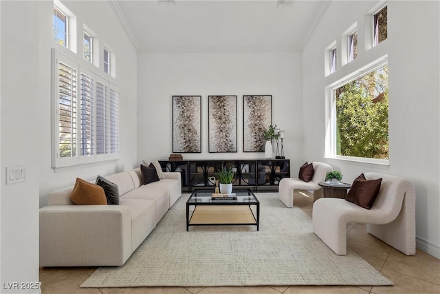 living area with a wealth of natural light and ornamental molding