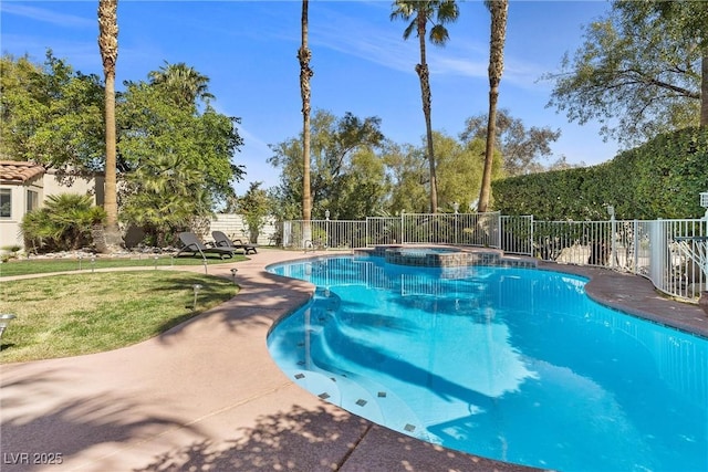 view of pool featuring a pool with connected hot tub, fence, and a lawn