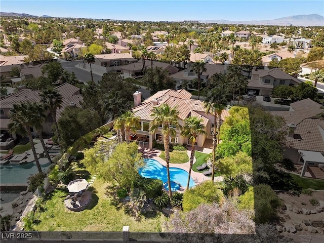 aerial view with a mountain view and a residential view