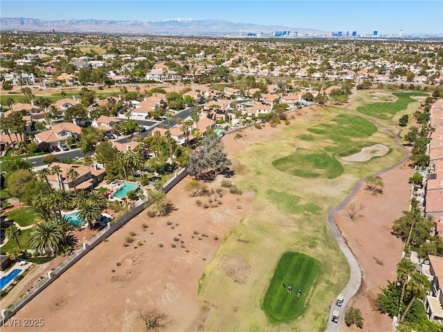 aerial view with a mountain view, golf course view, and a residential view