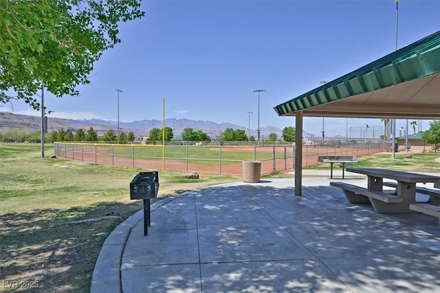 8919 Don Valley Ave, Las Vegas, NV 89148 - view of property's community featuring a mountain view, a yard, and fence