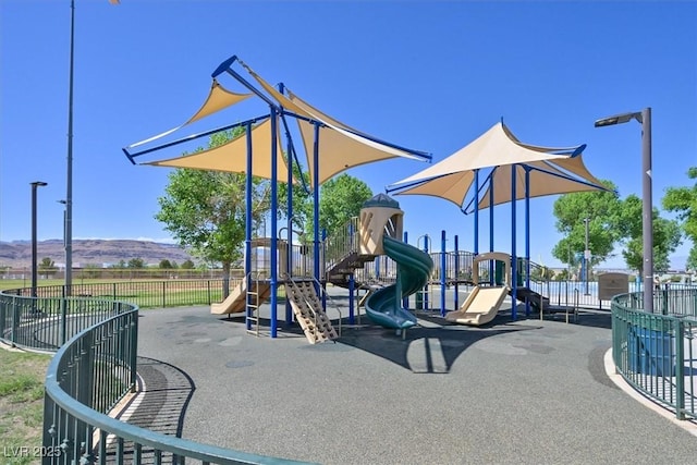 8919 Don Valley Ave, Las Vegas, NV 89148 - community play area with fence and a mountain view