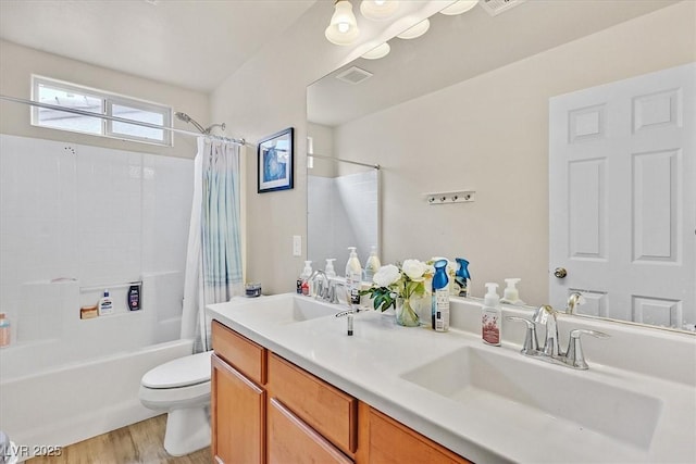 8919 Don Valley Ave, Las Vegas, NV 89148 - bathroom featuring visible vents, shower / tub combo with curtain, wood finished floors, toilet, and a sink