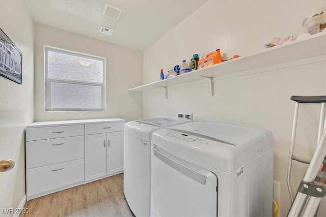 8919 Don Valley Ave, Las Vegas, NV 89148 - washroom featuring light wood-style floors, separate washer and dryer, cabinet space, and visible vents