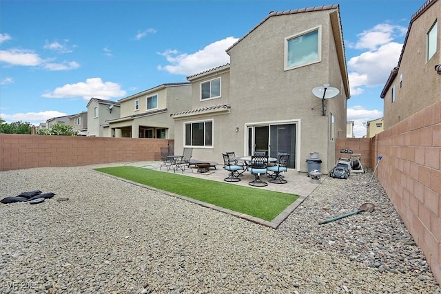 8919 Don Valley Ave, Las Vegas, NV 89148 - rear view of property with a fenced backyard, stucco siding, a patio area, and a tile roof
