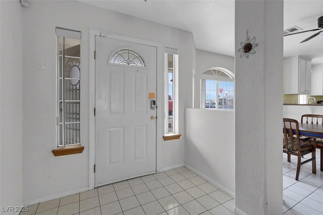 1800 Red Rock Dr, Pahrump, NV 89048 - foyer entrance featuring visible vents, baseboards, a ceiling fan, and light tile patterned floors