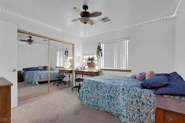 1800 Red Rock Dr, Pahrump, NV 89048 - bedroom featuring visible vents, a closet, a ceiling fan, and carpet floors
