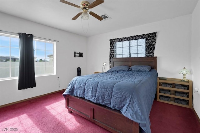 1800 Red Rock Dr, Pahrump, NV 89048 - bedroom with baseboards, carpet flooring, ceiling fan, and visible vents