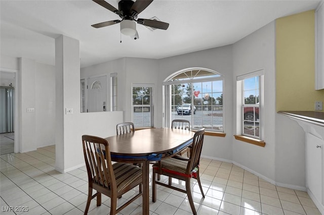 1800 Red Rock Dr, Pahrump, NV 89048 - dining area featuring light tile patterned floors, baseboards, and a ceiling fan