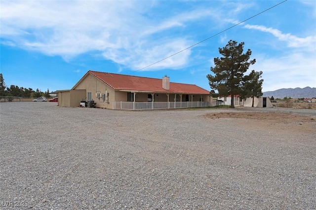 1800 Red Rock Dr, Pahrump, NV 89048 - view of front of house with a chimney and stucco siding
