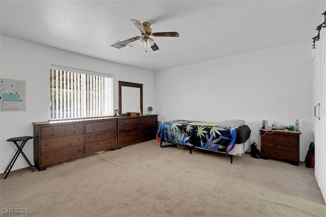 1800 Red Rock Dr, Pahrump, NV 89048 - bedroom with light carpet and a ceiling fan