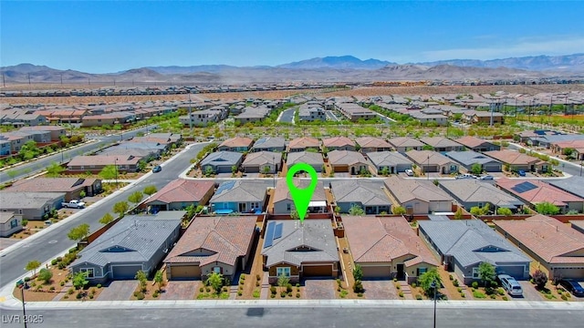 aerial perspective of suburban area with a mountain backdrop