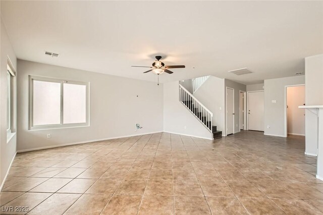 7829 Lovely Pine Pl, Las Vegas, NV 89143 - unfurnished living room featuring stairway, a ceiling fan, and light tile patterned floors