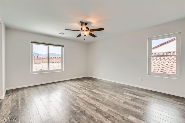 7829 Lovely Pine Pl, Las Vegas, NV 89143 - spare room with visible vents, baseboards, wood finished floors, and ceiling fan