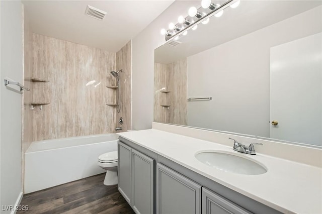 7829 Lovely Pine Pl, Las Vegas, NV 89143 - full bathroom featuring bathing tub / shower combination, vanity, visible vents, toilet, and wood finished floors